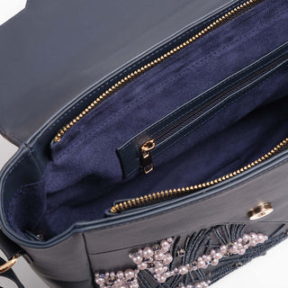 Spacious navy tote bag with multiple compartments.